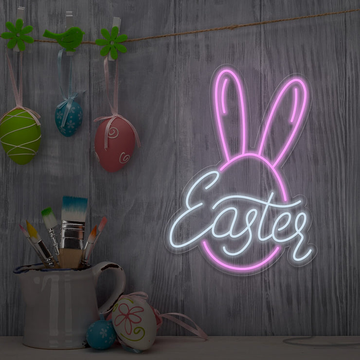 light pink easter bunny neon sign hanging on wall