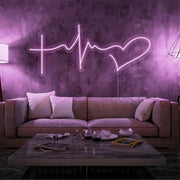 light pink faith hope and love neon sign hanging on living room wall