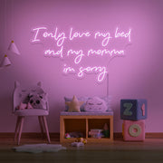 light pink I only love my bed and my momma I'm sorry neon sign hanging on kids wall