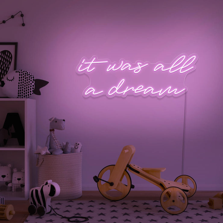 light pink it was all a dream neon sign hanging on kids bedroom wall