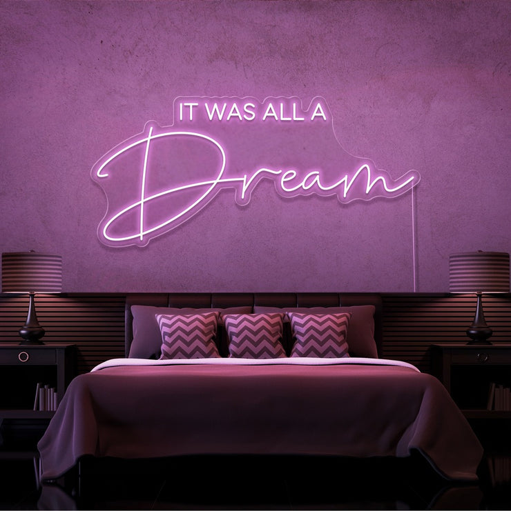 light pink it was all a dream neon sign hanging on bedroom wall