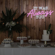 light pink it was always you neon sign hanging above dessert table