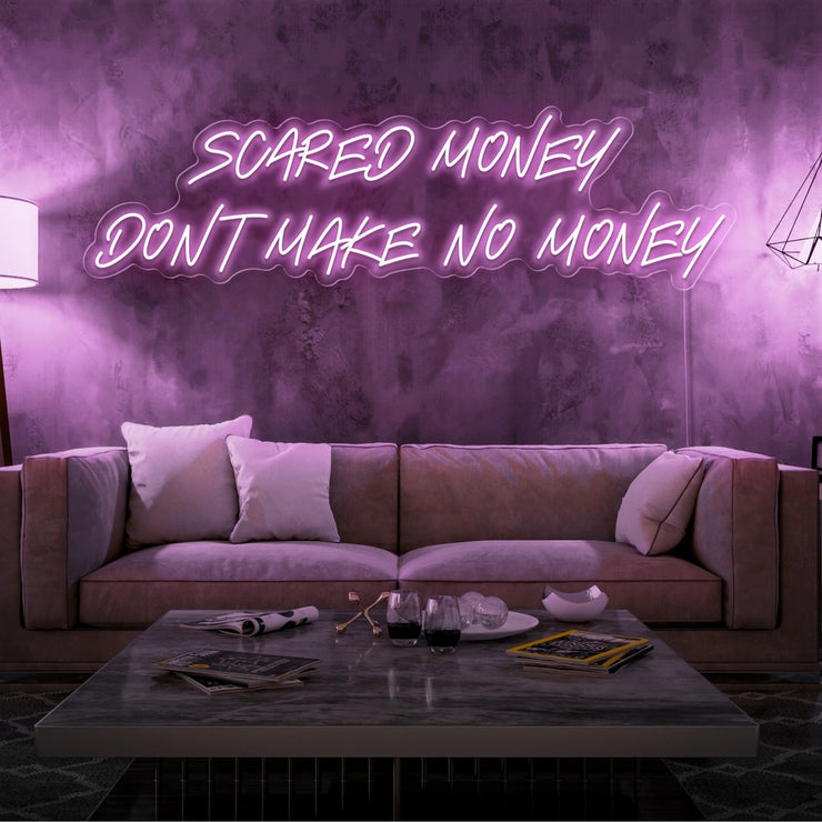 light pink scared money dont make no money neon sign hanging on living room wall