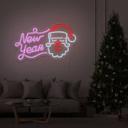 light pink new year santa neon sign hanging on living room wall