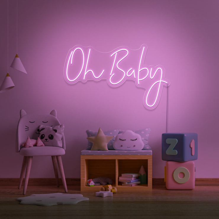 light pink oh baby neon sign hanging on kids bedroom wall