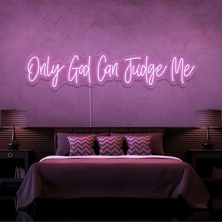 light pink only god can judge me neon sign hanging on bedroom wall