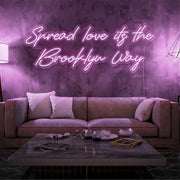 light pink spread love the brooklyn way neon sign hanging on living room wall