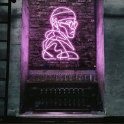 light pink street cred neon sign hanging on bar wall