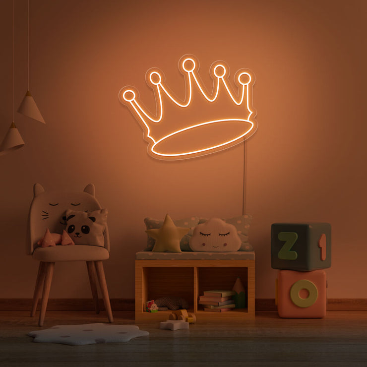 orange crown neon sign hanging on kids bedroom wall