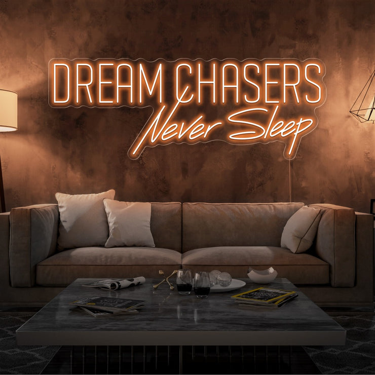 orange dream chasers never sleep neon sign hanging on living room wall