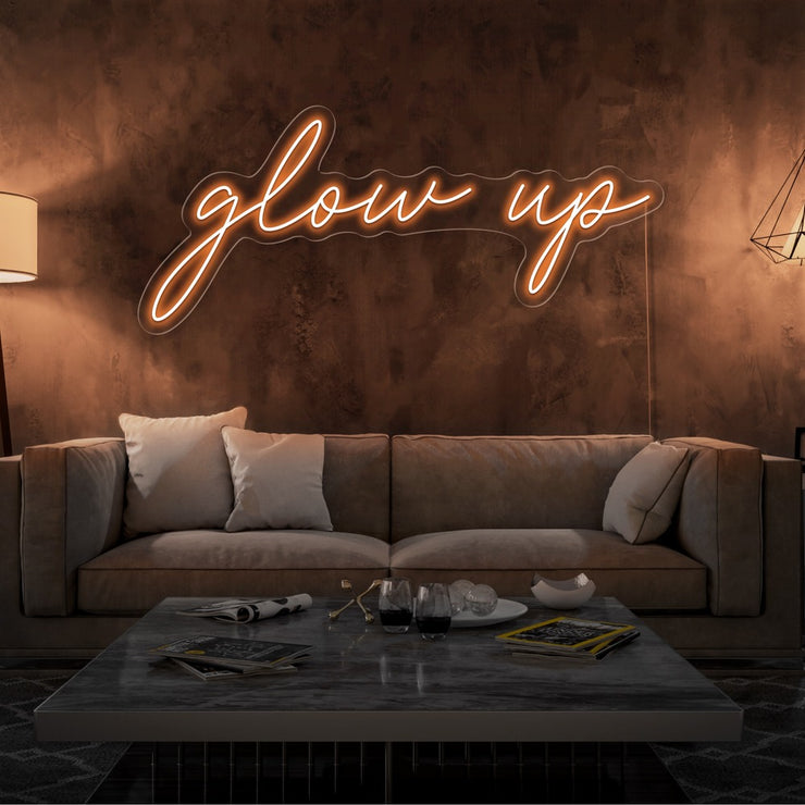 orange glow up neon sign hanging on living room wall