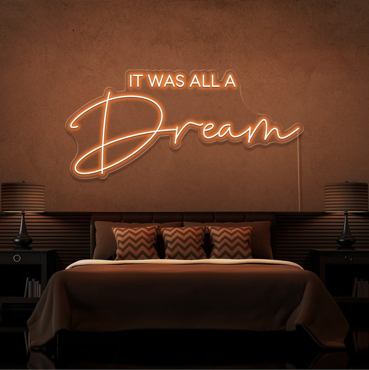 orange it was all a dream neon sign hanging on bedroom wall