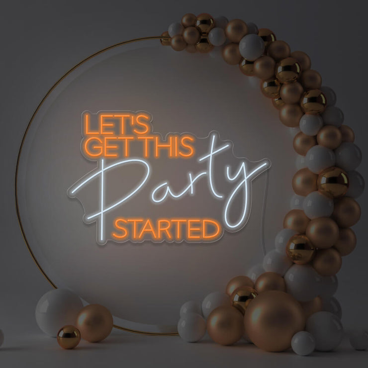orange lets get this party started neon sign hanging in gold hoop frame
