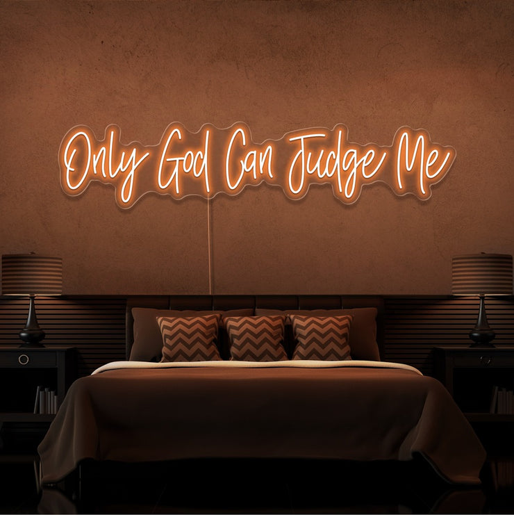 orange only god can judge me neon sign hanging on bedroom wall