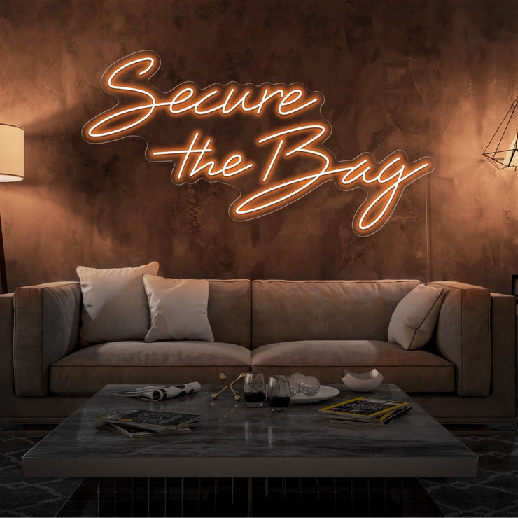 orange secure the bag neon sign hanging on living room wall