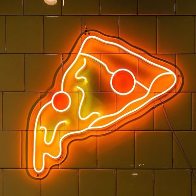 pizza slice neon sign hanging on wall