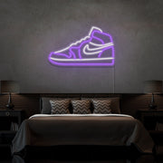 purple air jordan 1 sneaker neon sign hanging on bedroom wall