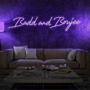 purple bad and boujee neon sign hanging on living  room wall