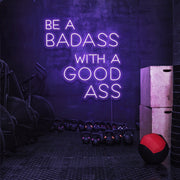 purple be a badass with a good ass neon sign hanging on gym wall