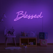 purple blessed neon sign hanging on kids bedroom wall