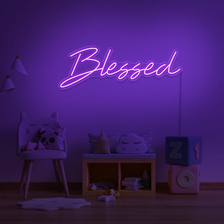 purple blessed neon sign hanging on kids bedroom wall