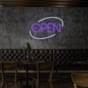 purple open neon sign hanging on restaurant wall