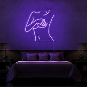 purple cover up neon sign hanging on bedroom wall