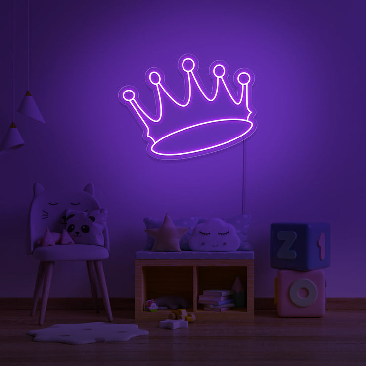 purple crown neon sign hanging on kids bedroom wall