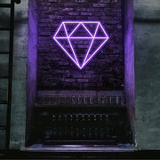 purple diamond neon sign hanging on bar wall