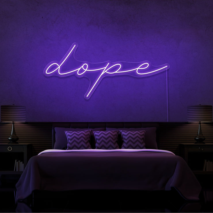 purple dope cursive neon sign hanging on bedroom wall
