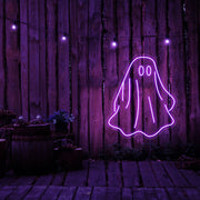 purple draped ghost neon sign hanging on timber wall