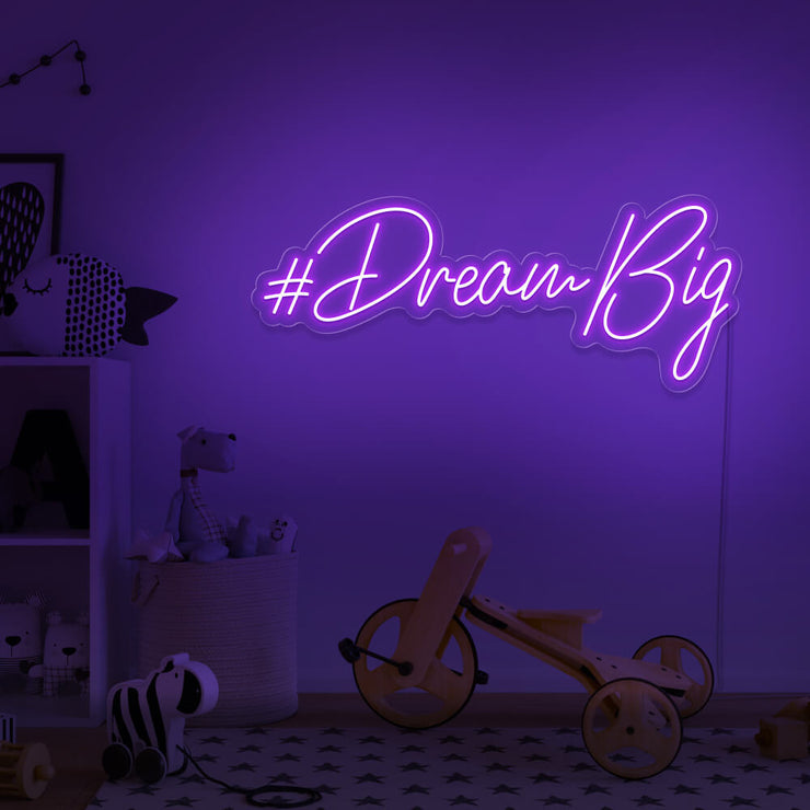 purple dream big neon sign hanging on kids bedroom wall