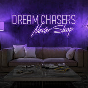 purple dream chasers never sleep neon sign hanging on living room wall