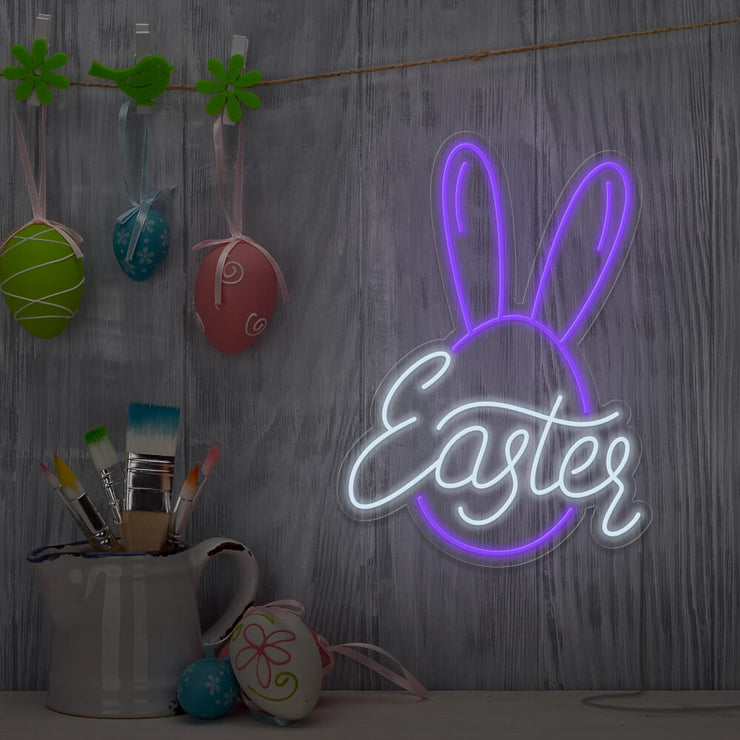 purple easter bunny neon sign hanging on wall