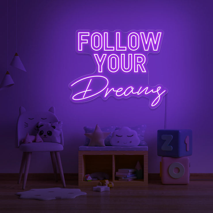 purple follow your dreams neon sign hanging on kids bedroom wall