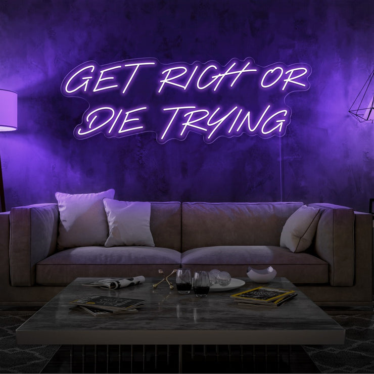 purple get rich or die trying neon sign hanging  on living room wall