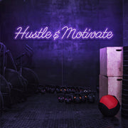 purple hustle and motivate neon sign hanging on gym wall