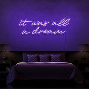 purple it was all a dream neon sign hanging on bedroom wall