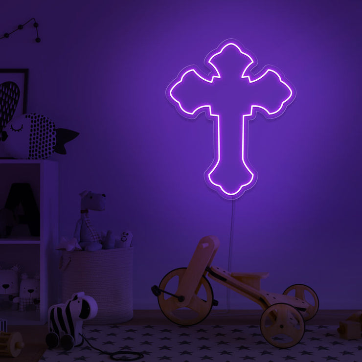 purple cross neon sign hanging on kids bedroom wall