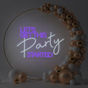 purple lets get this party started neon sign hanging in gold hoop frame