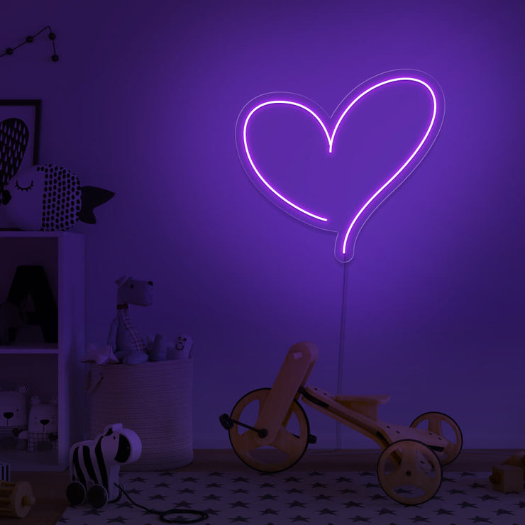 purple love heart neon sign hanging on kids bedroom wall
