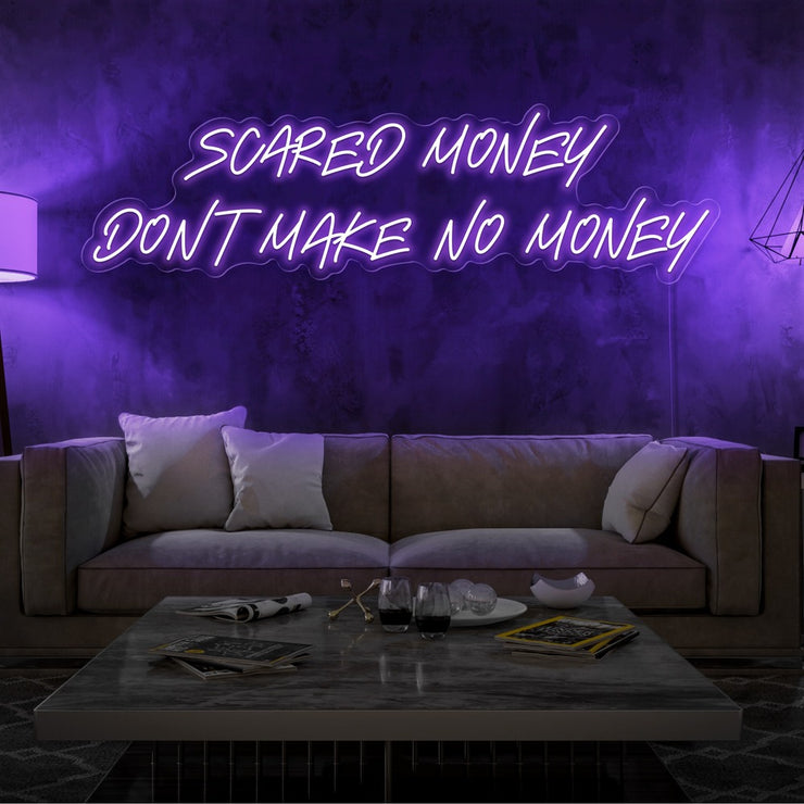 purple scared money dont make no money neon sign hanging on living room wall