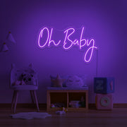purple oh baby neon sign hanging on kids bedroom wall