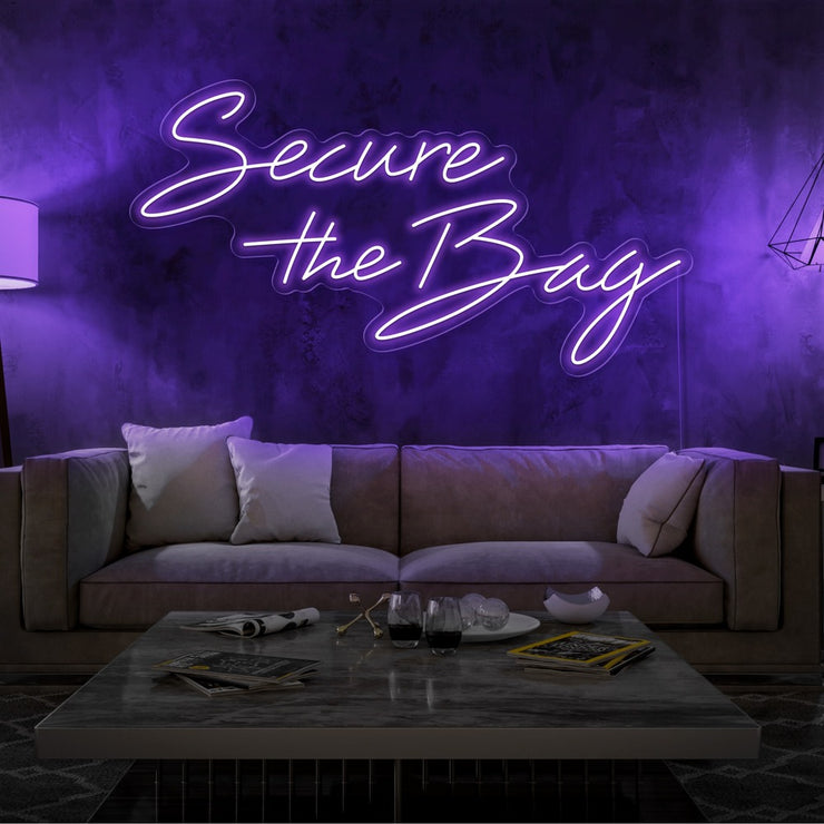 purple secure the bag neon sign hanging on living room wall
