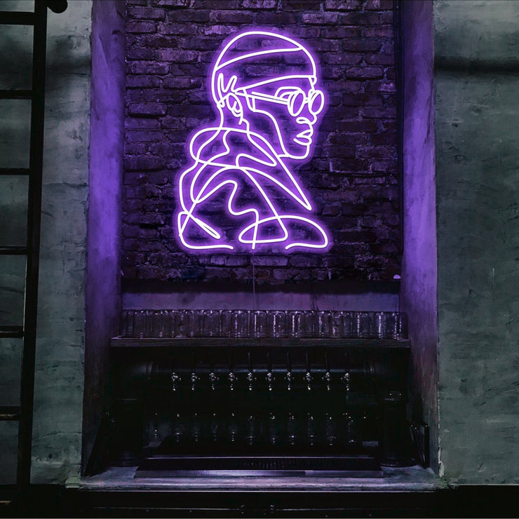 purple street cred neon sign hanging on bar wall