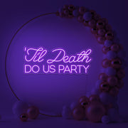 purple til death do us party neon sign in gold hoop backdrop with balloons
