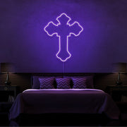 purple tupac cross neon sign hanging on bedroom wall