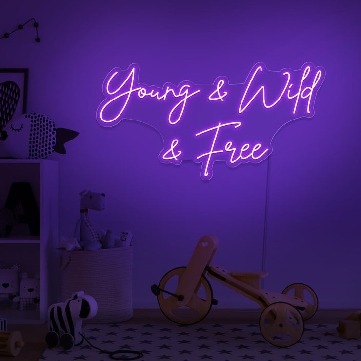 purple young wild and free neon sign hanging on kids bedroom wall