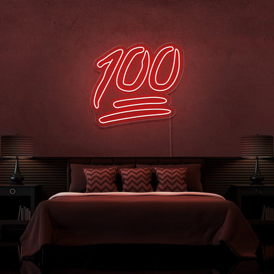 red 100 neon sign hanging on bedroom wall