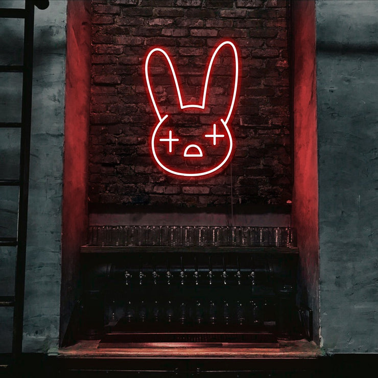 red bad bunny neon sign hanging on bar wall